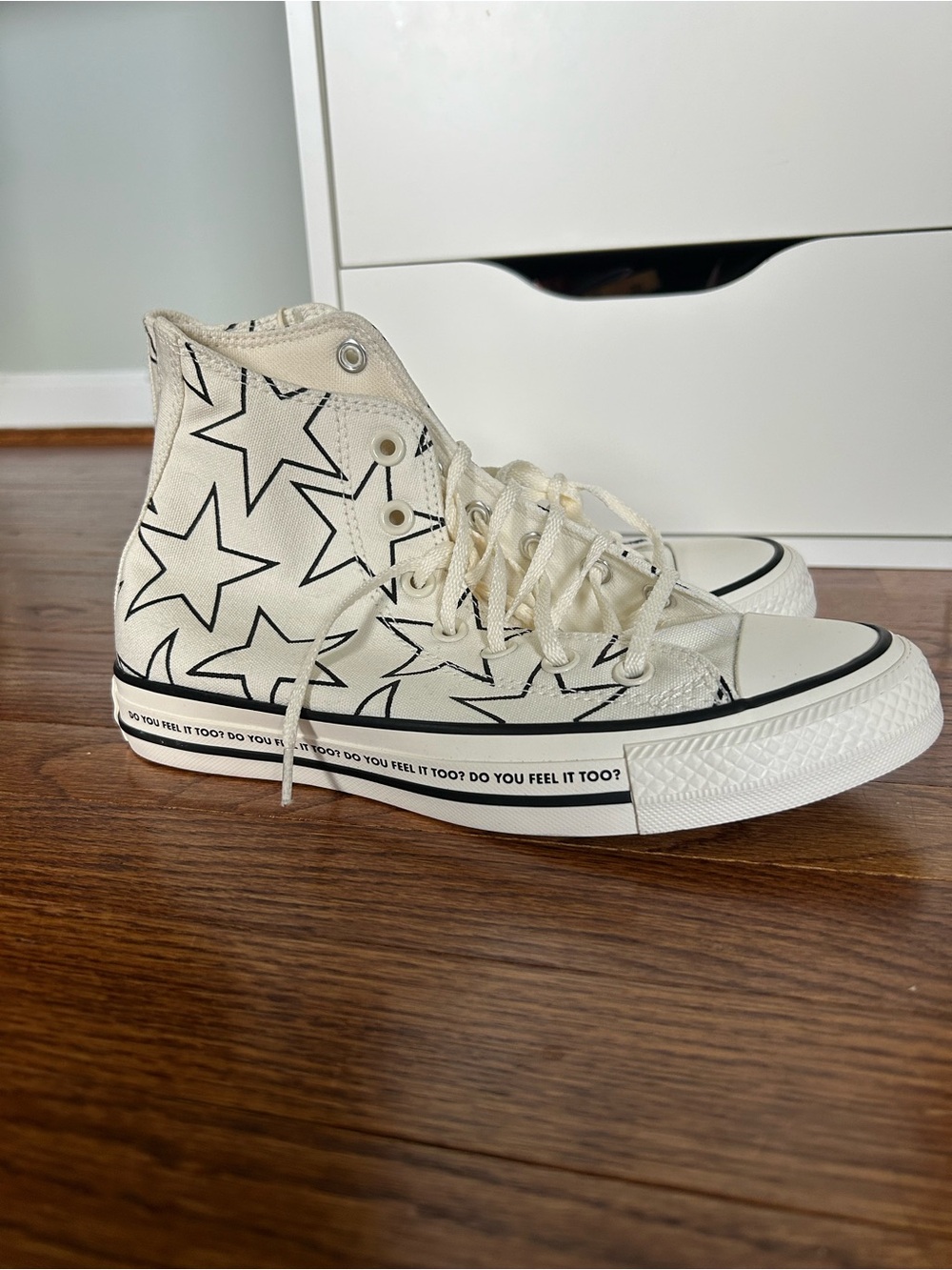 Converse High Top Sneakers in Cream with Black Star Print